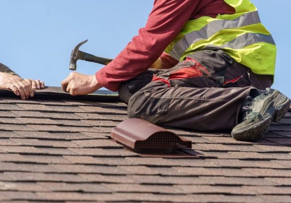 NAV Restoration installing roof cap on new roof remodel