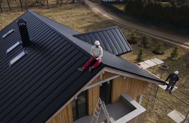 Finishing a standing seam metal roof installation for NAV Restoration