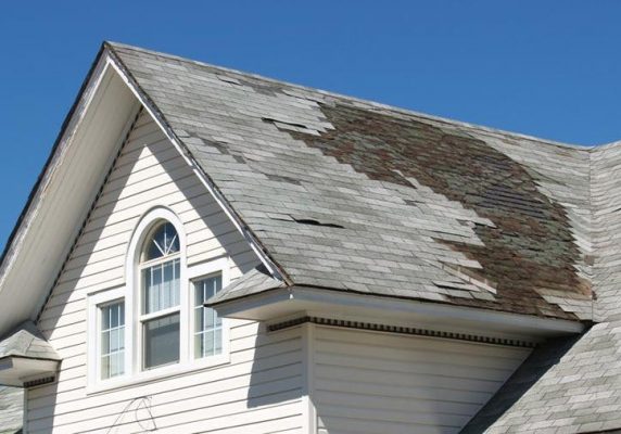 Picture of a damage roof with missing shingles for NAV Restoration