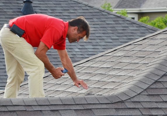 NAV Restoration inspecting roof for damage